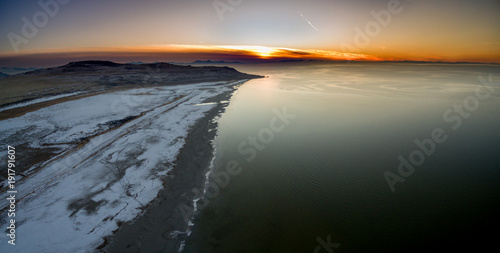 Aerial seascape of a coastline during a golden sunset