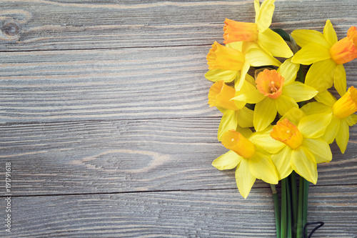 Fototapeta Naklejka Na Ścianę i Meble -  Daffodils flowers on wooden background 