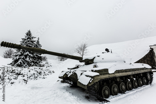 battle tanks moving in a snow storm
