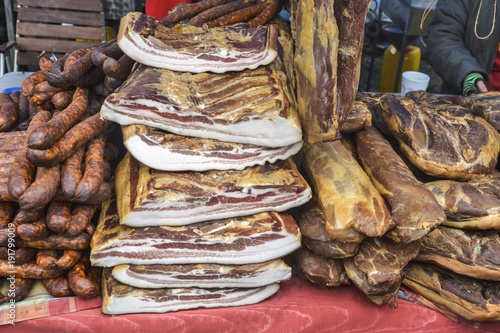 Raw bacon, sausages and ham for sale