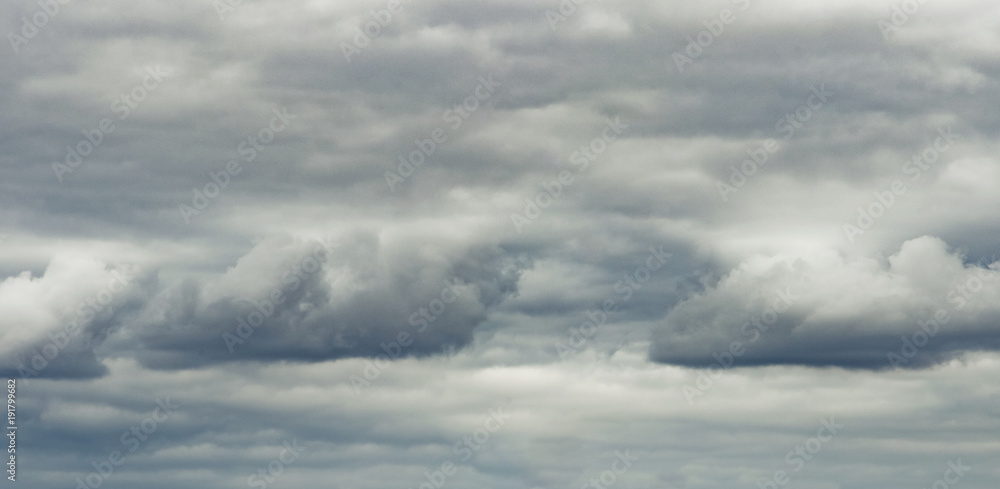 The panorama of overcast texture with clouds. Copy space.A lot of clouds in dramatic filter.