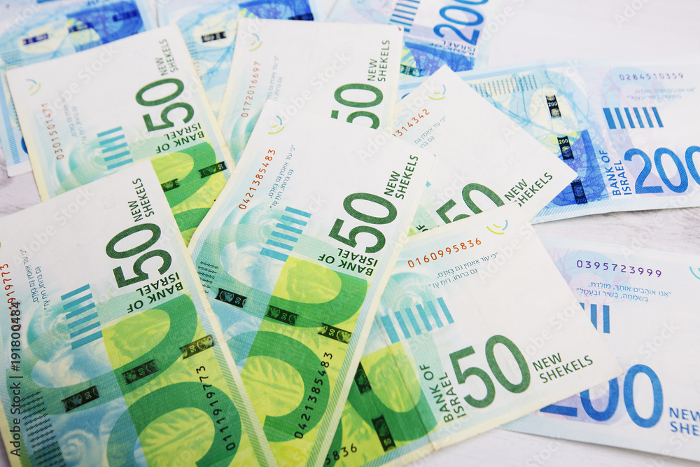 Israely Shekel money bills collection background.