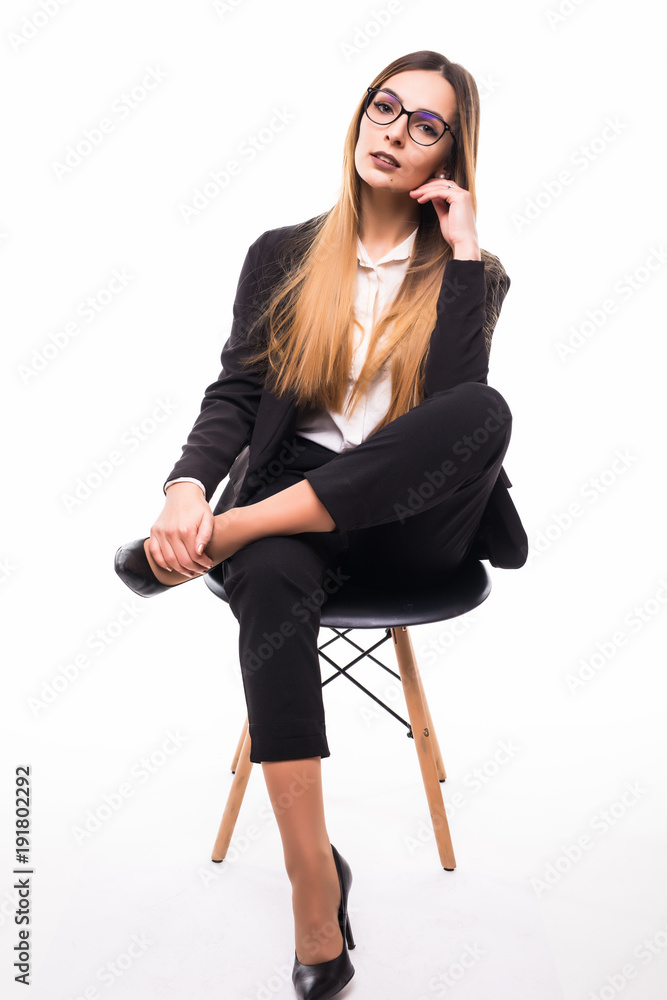 Smiling business woman in glasses sitting in chair. Young businesswoman smile isolated over white background Smiling business woman in glasses sitting in chair. Young businesswoman smile isolated over white background