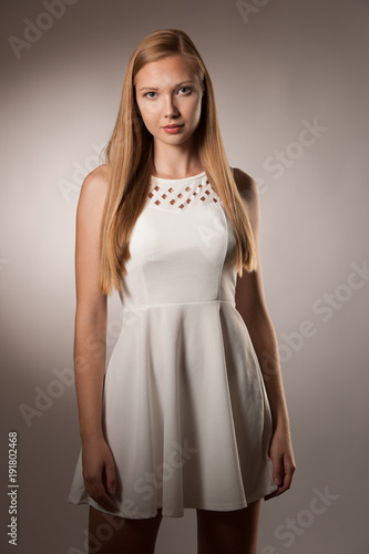 Moody studio portrait of a beautiful young brunette woman with long hair