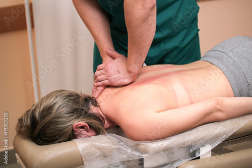 Alternative medicine - doctor osteopath have manual therapy for woman's back