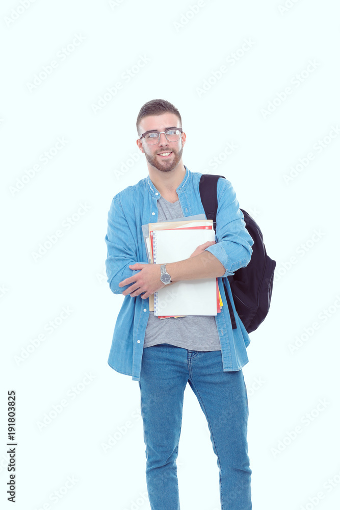 A male student with a school bag holding books isolated on white background. Education opportunities. College student. A male student with a school bag holding books isolated on white background. Education opportunities. College student.