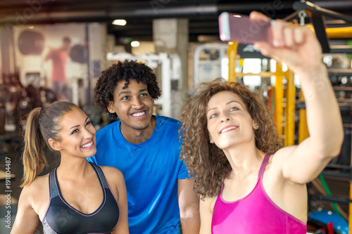 Group of friends taking a selfie while working out