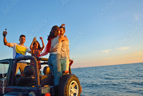 Group of happy friends making party in car - Young people having fun drinking champagne