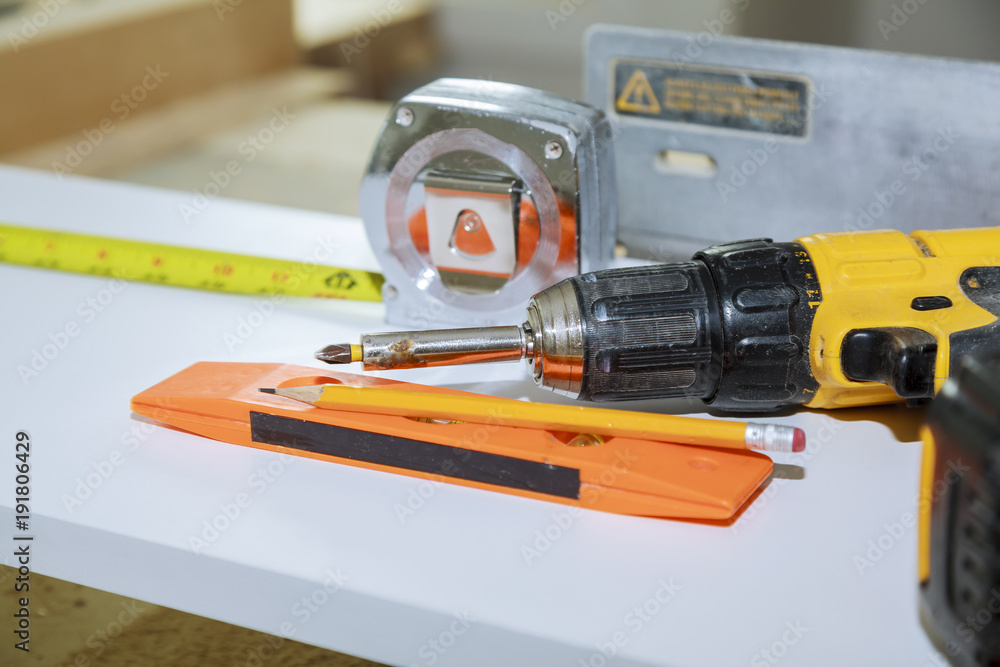 Construction Tools With Blueprint On Wooden Desk Construction Tools With Blueprint On Wooden Desk