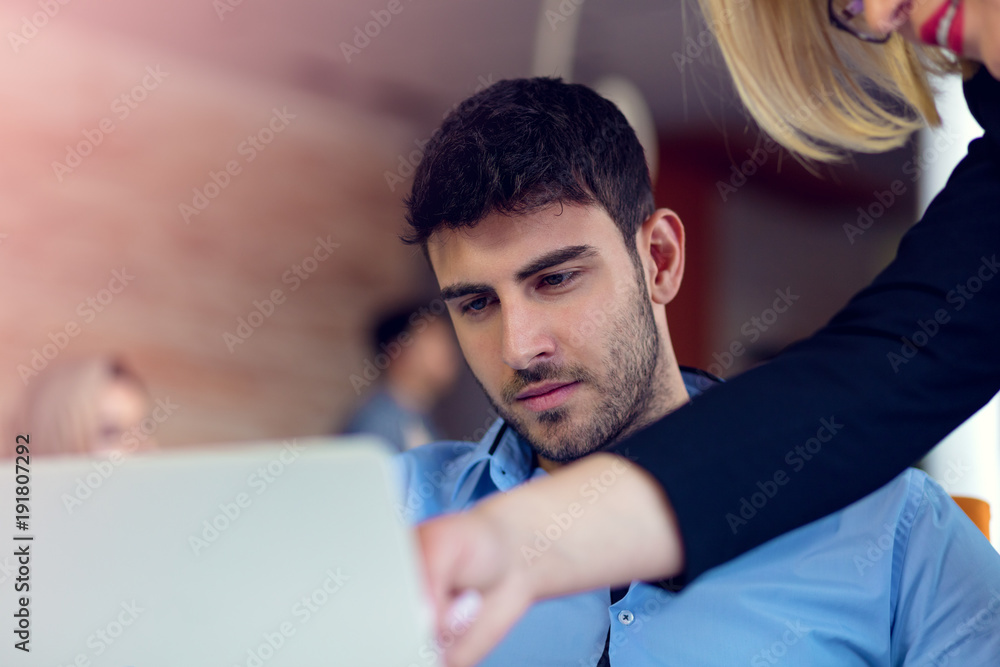 Skilled professional blonde female CEO explaining to young male employee requires and strategy Skilled professional blonde female CEO explaining to young male employee requires and strategy