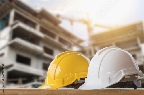 yellow and white helmet safety in construction site