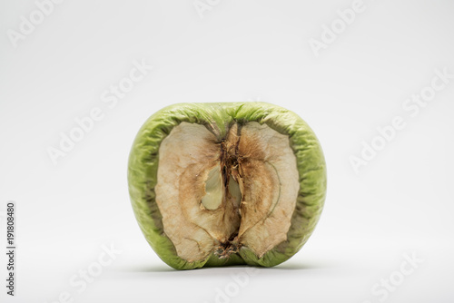 isolated green apple, rotting