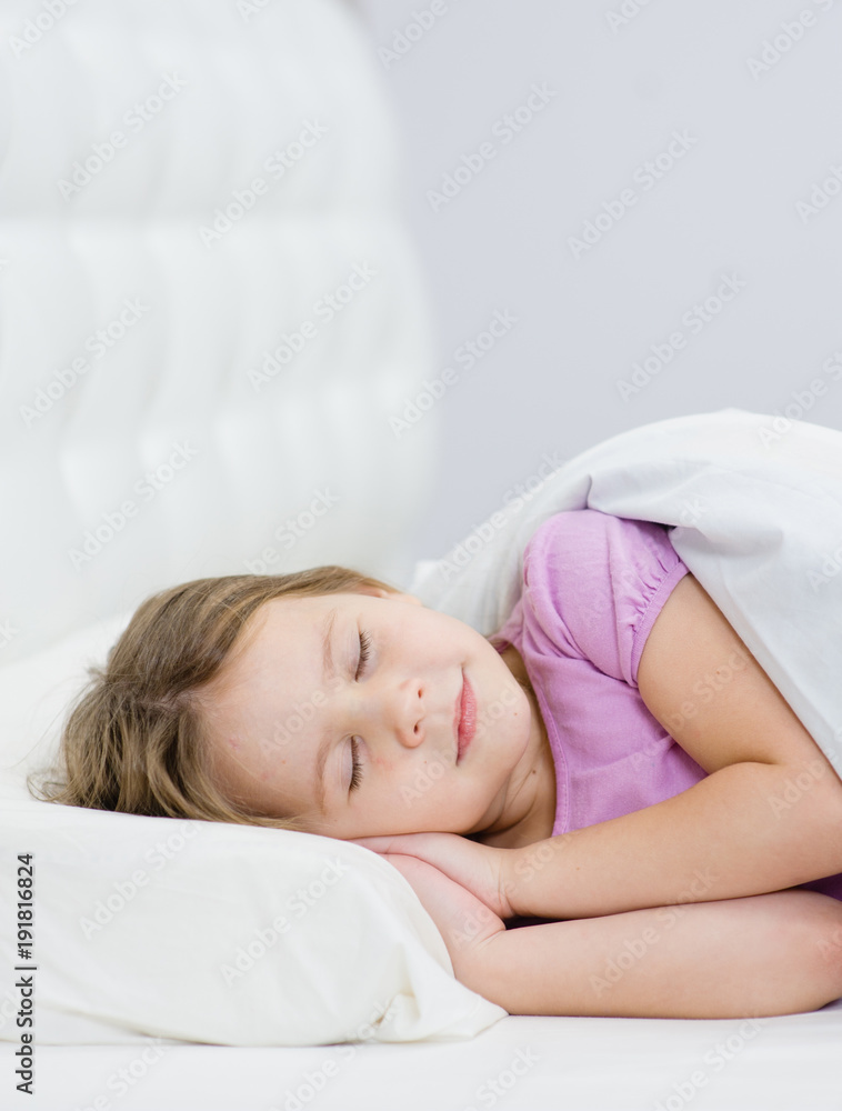 little girl sleeping on the bed. Space for text little girl sleeping on the bed. Space for text