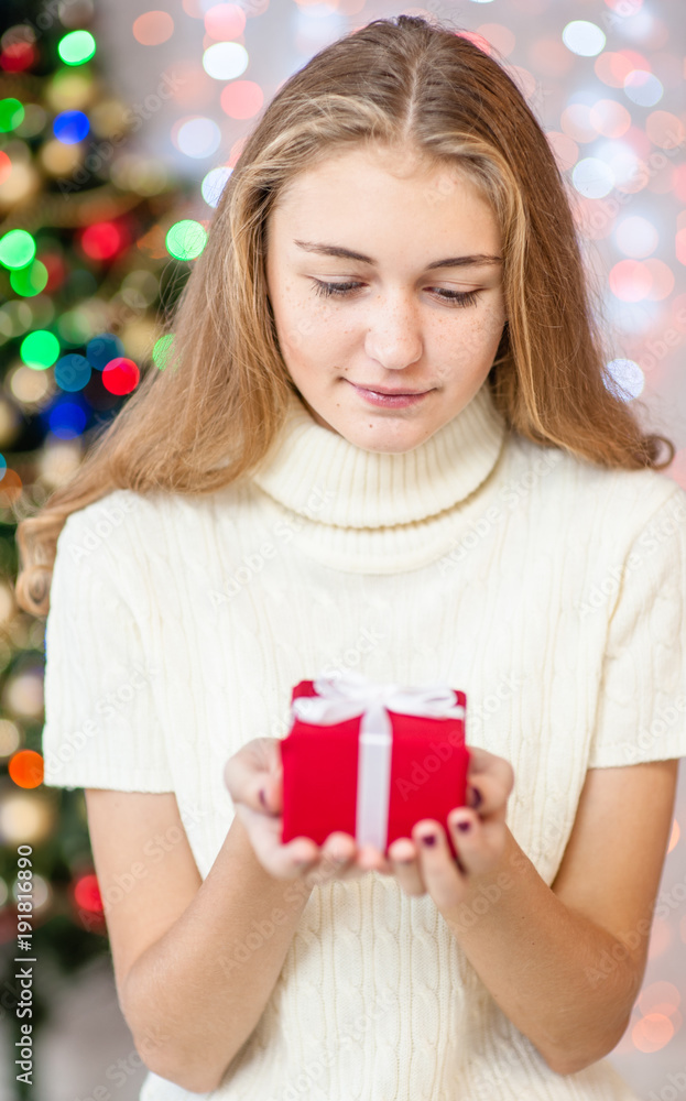 Teen girl with christmas present Teen girl with christmas present