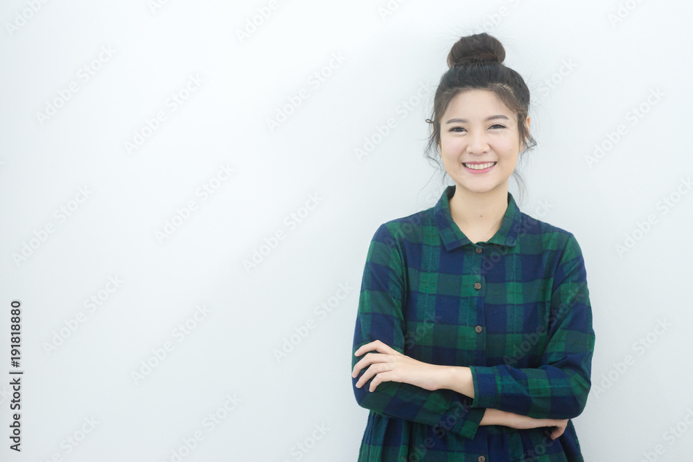 woman standing on wall and smile woman standing on wall and smile