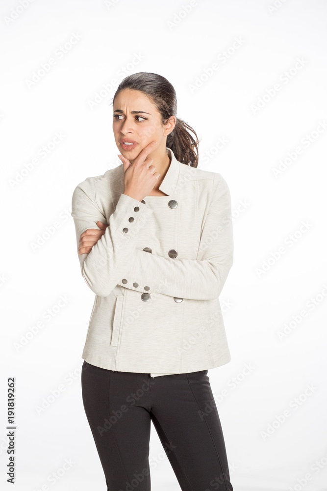 Young professional woman dressed for business with arms folded looking serious. Great concept for work, business or planning. Young professional woman dressed for business with arms folded looking serious. Great concept for work, business or planning.