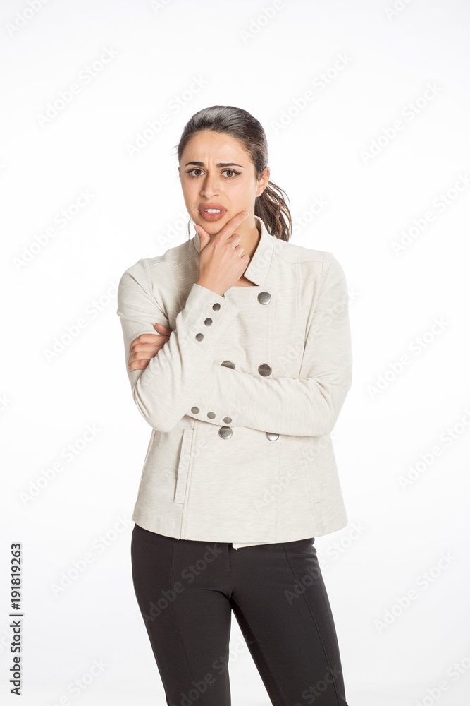 Young professional woman dressed for business with arms folded looking serious. Great concept for work, business or planning. Young professional woman dressed for business with arms folded looking serious. Great concept for work, business or planning.