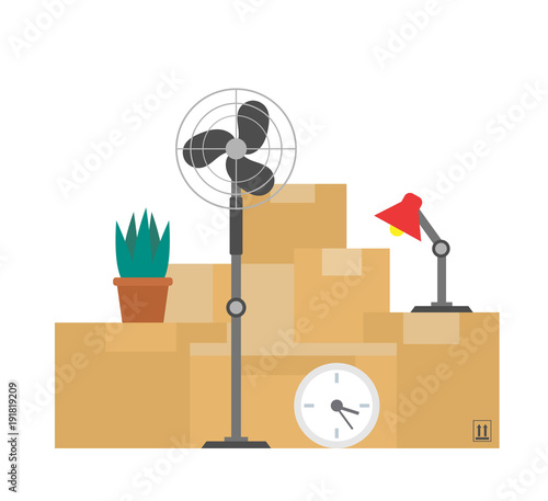 cardboard boxes with things plant lamp clock fan.moving day concept