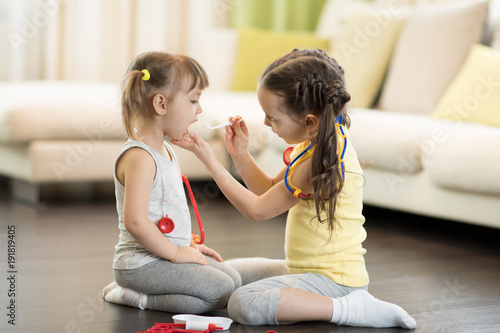 Child girl, playing doctor ...