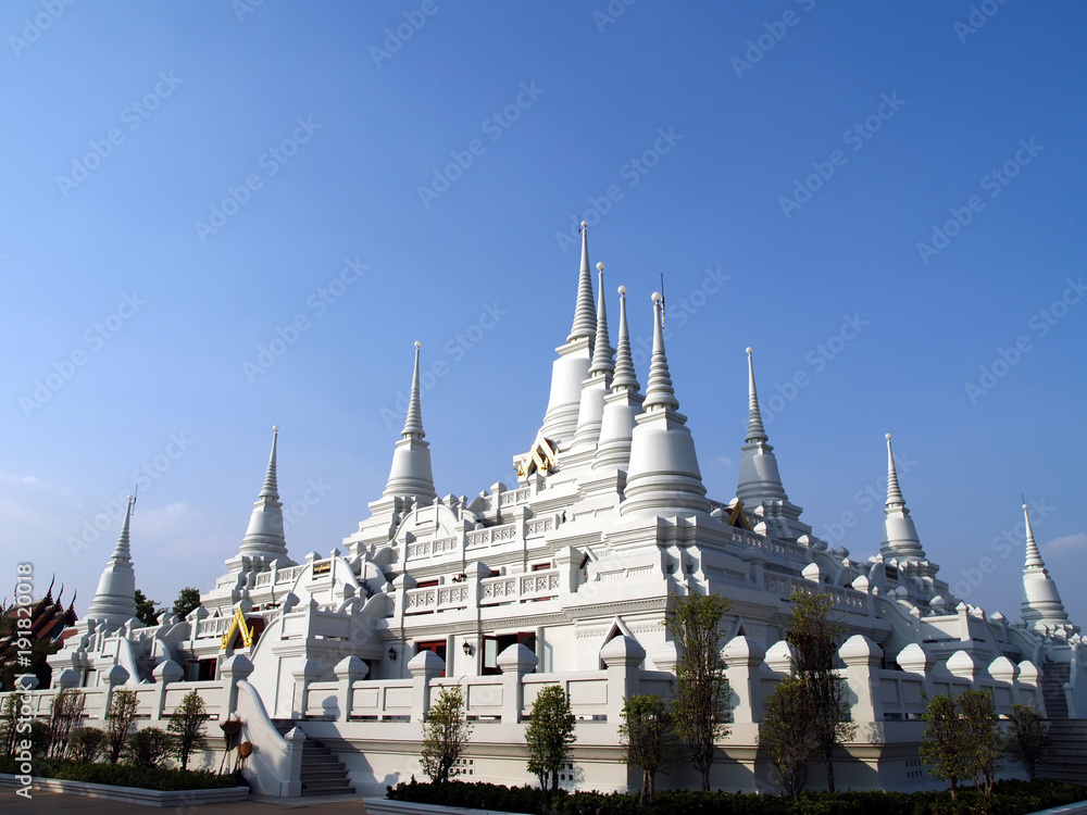 group of pure white pagoda at wat asokaram, thai famous tourist destination