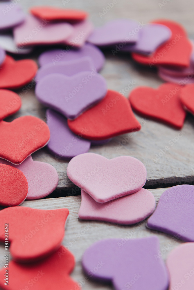 Background for design to Valentine's Day. Decorative red purple ultraviolet hearts. View from above. Valentines Day concept Background for design to Valentine's Day. Decorative red purple ultraviolet hearts. View from above. Valentines Day concept