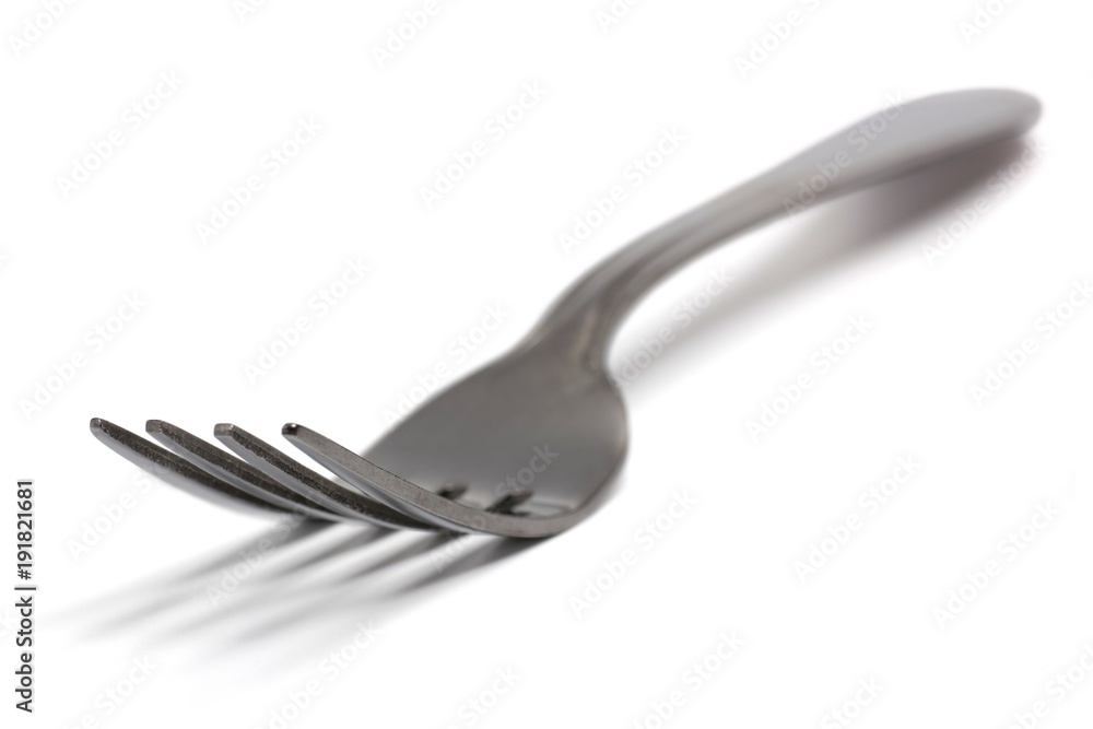 One single fork on white background One single fork on white background