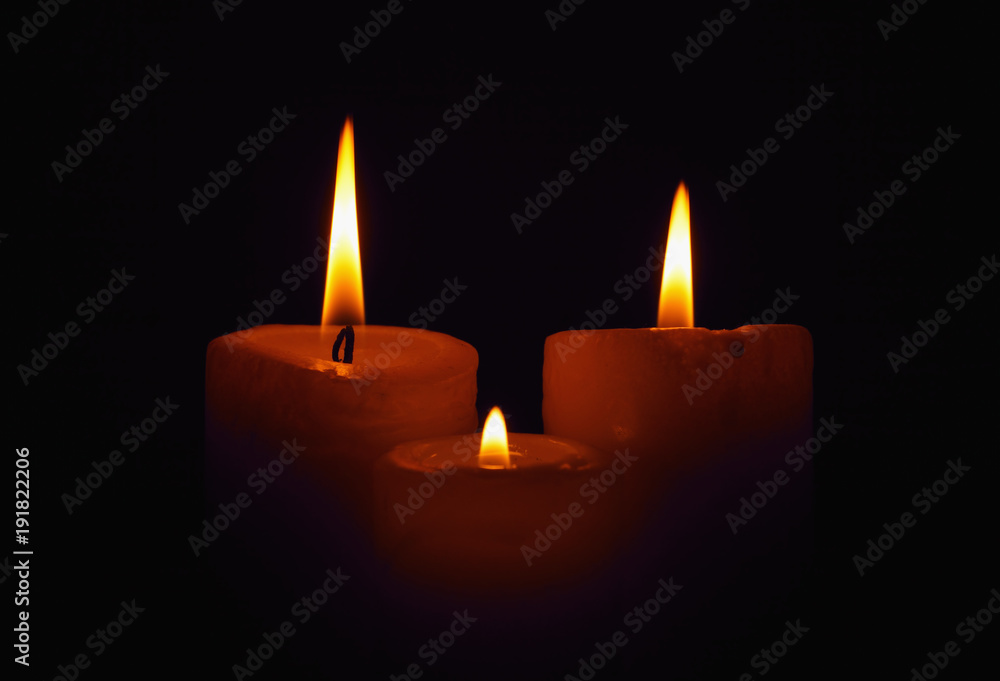 Three burning candles in the darkness Three burning candles in the darkness