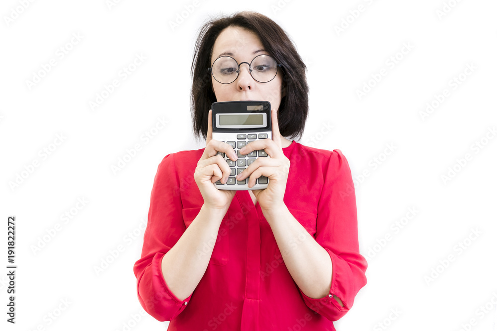 Worried young businesswoman holding a calculator Worried young businesswoman holding a calculator