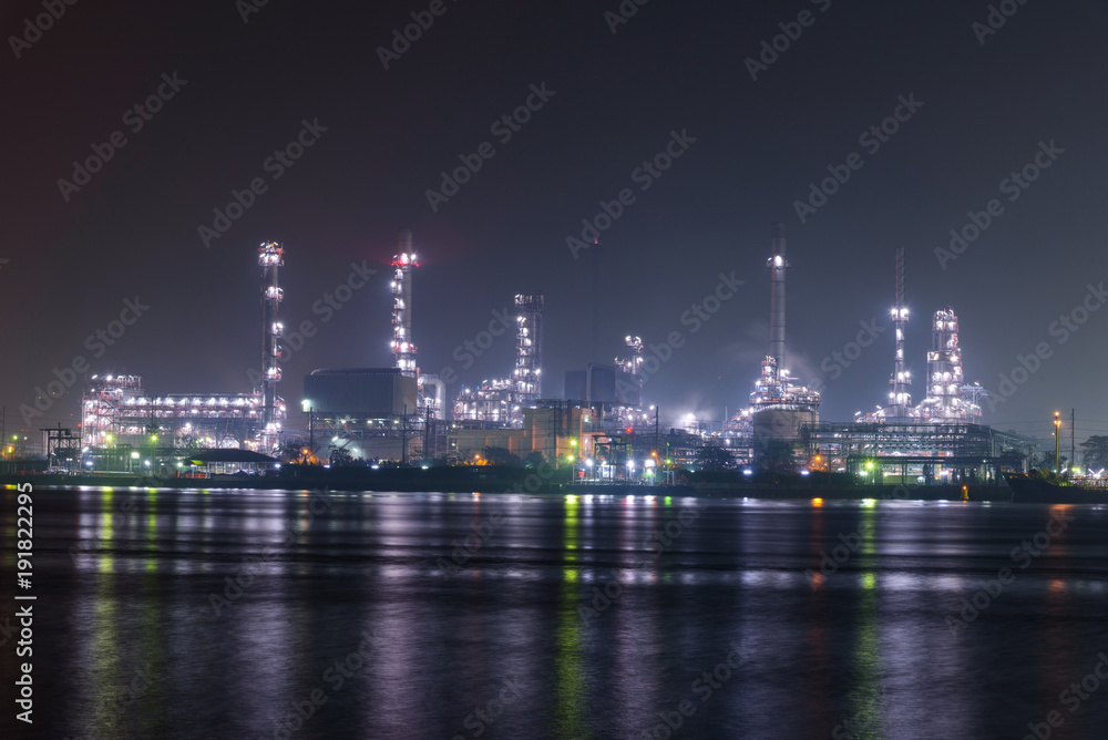 Big factory at the river in night time 