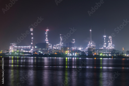 Big factory at the river in night time 