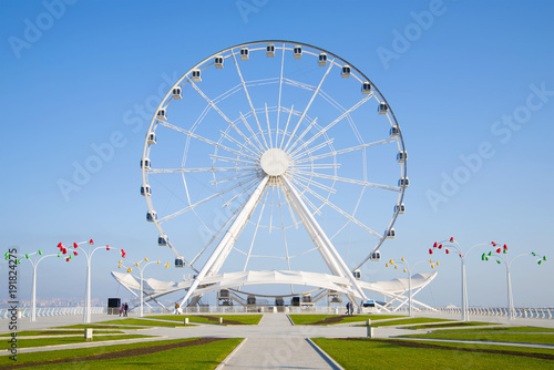 Ferris wheel close-up against the blue sky. Baku, Azerbaijan