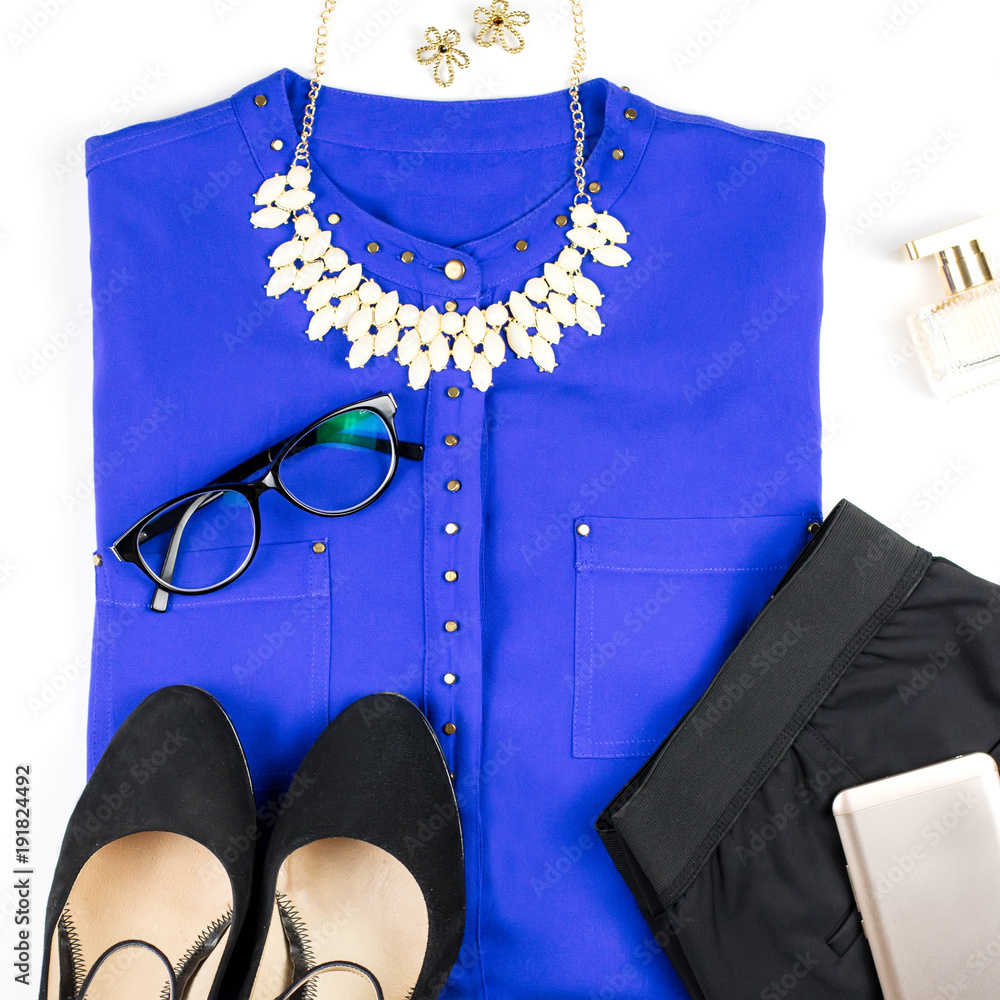 Female smart casual style clothing and accessories -purple shirt, black  pants, fashion accessories. Stock Photo