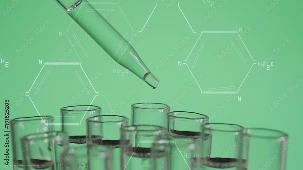 Close up of laboratory scientist working with a pipette analyzes and extract the DNA or molecules in the test tubes.on green background with graphic interface Close up of laboratory scientist working with a pipette analyzes and extract the DNA or molecules in the test tubes.on green background with graphic interface