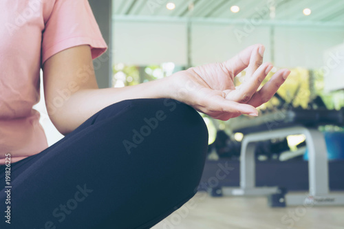 Asian Fitness Woman Warm Up before do Exercise in Gym, Middle Age Female Working out Yoga photo