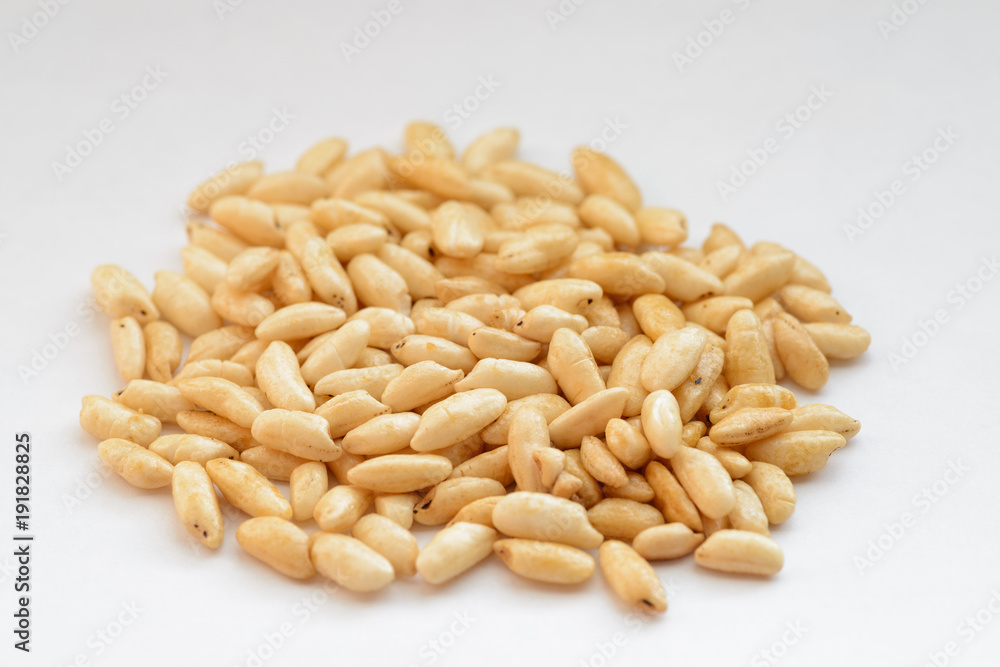 Puffed rice on white background. Selective focus. Puffed rice on white background. Selective focus.