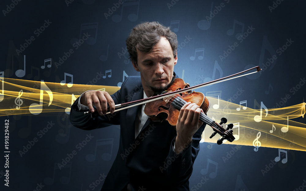 Fototapeta premium Musician playing on violin with notes around