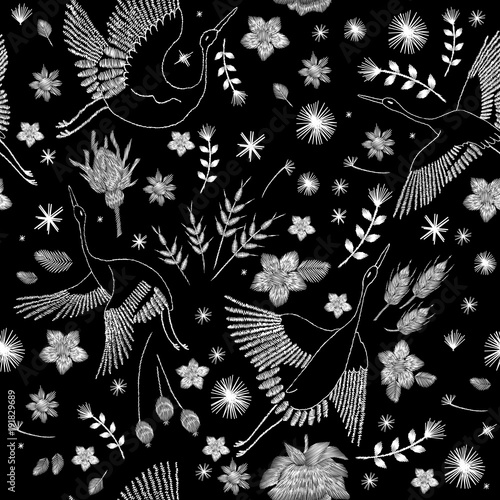 Crane bird, flowers, rose, rose-hip, plant. Traditional folk stylish stylish embroidery on the black background. Sketch for printing on clothing, fabric, bag, accessories and design. Vector, trend