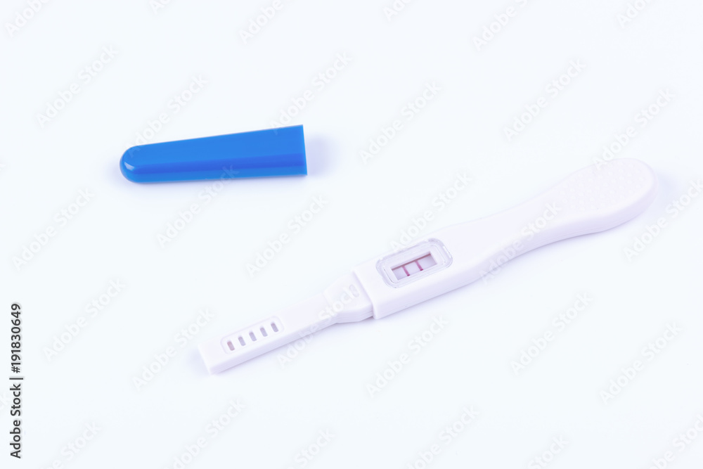 Positive pregnancy test on white background
Positive pregnancy test on white background