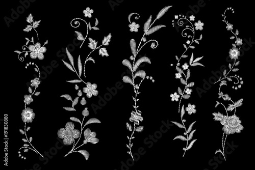  white lace. Traditional folk flower fashionable embroidery on the black background. A bouquet of roses and a dog rose, for printing on clothes, vector