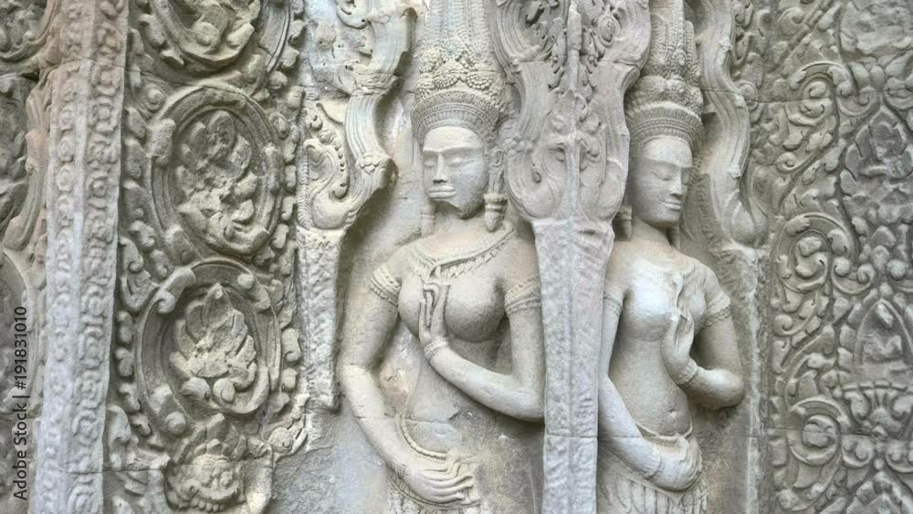 tilt down shot of two devata at ta prohm temple near angkor wat, cambodia tilt down shot of two devata at ta prohm temple near angkor wat, cambodia