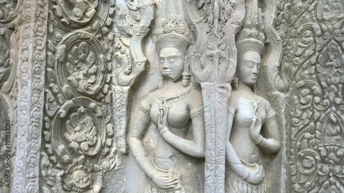 Wallpaper Mural tilt down shot of two devata at ta prohm temple near angkor wat, cambodia Torontodigital.ca