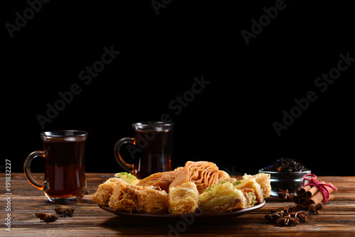 Turkish sweet baklava on plate with Turkish tea. 