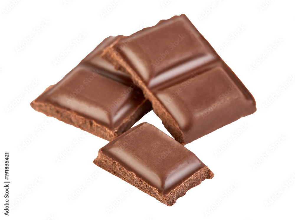 Milk chocolate pieces isolated on white background.