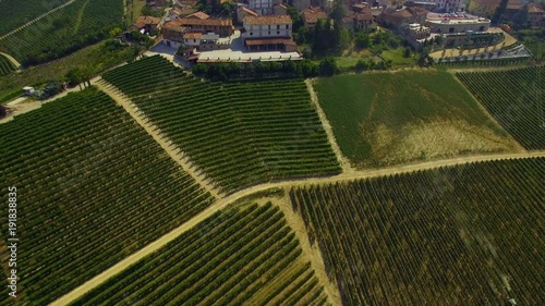 Aerial view of Italian town Serralunga d'Alba with vineyards surrounding it. Piedmont region. photo