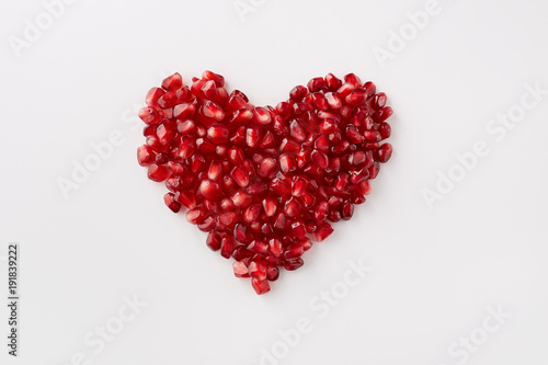 Pomegranate seeds in a shape of a heart