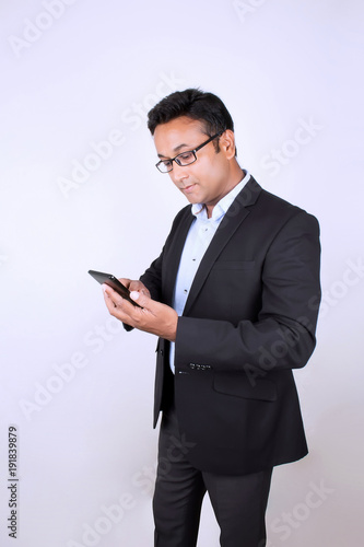 Young man operating smartphone
