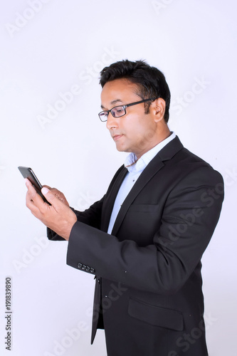 Young man operating smartphone © 11081983