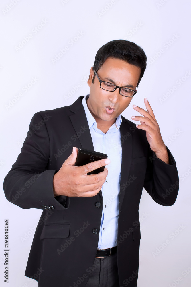 Young man operating smartphone Young man operating smartphone