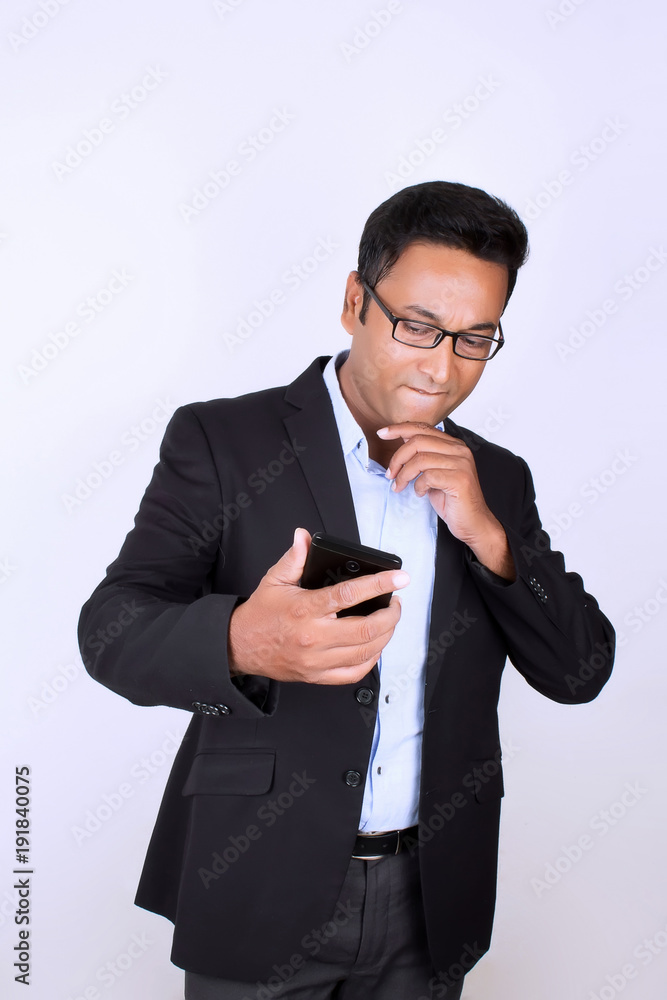 Young man operating smartphone Young man operating smartphone