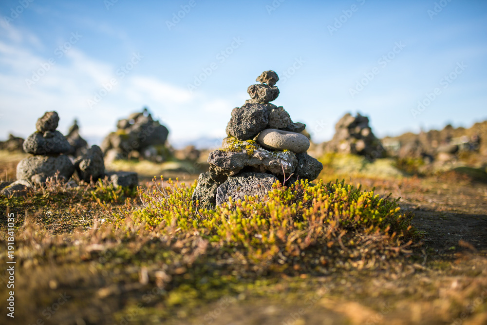 Laufscalavarda, a lava ridge, surrounded by stone cairns - Iceland Laufscalavarda, a lava ridge, surrounded by stone cairns - Iceland